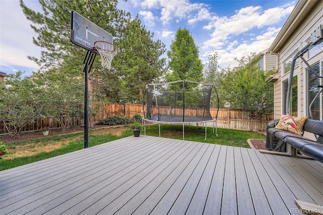 455 Bexley St, Littleton, CO 80126 - wooden terrace featuring a trampoline and a fenced backyard