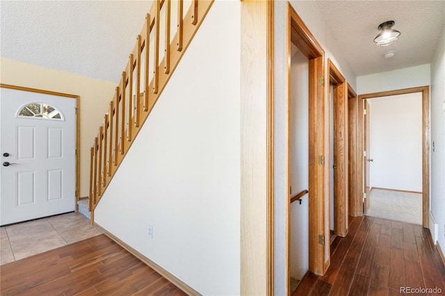 foyer featuring hardwood / wood-style floors and a textured ceiling