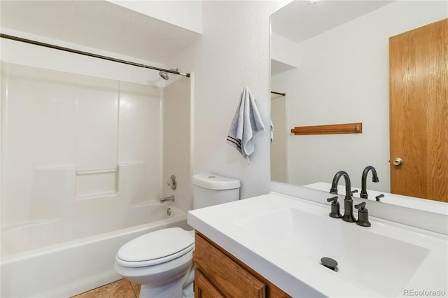 full bathroom featuring tile patterned floors, vanity, toilet, and shower / washtub combination