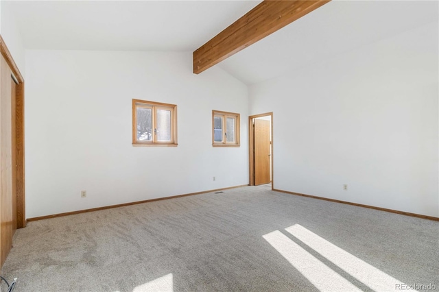 unfurnished bedroom with vaulted ceiling with beams, a closet, and light colored carpet