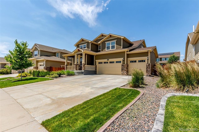 16321 Clayton St, Thornton, CO 80602 - craftsman-style home with concrete driveway, stone siding, a porch, and a garage
