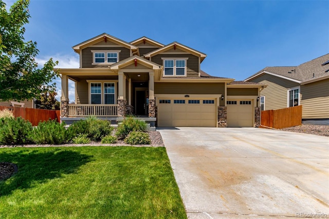 16321 Clayton St, Thornton, CO 80602 - craftsman house featuring a porch, concrete driveway, stone siding, and a garage