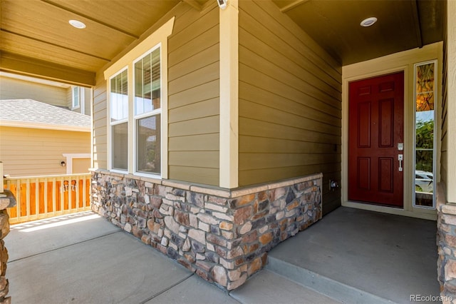 16321 Clayton St, Thornton, CO 80602 - view of exterior entry with covered porch and stone siding
