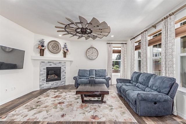 16321 Clayton St, Thornton, CO 80602 - living room featuring recessed lighting, wood finished floors, ceiling fan, and a tile fireplace