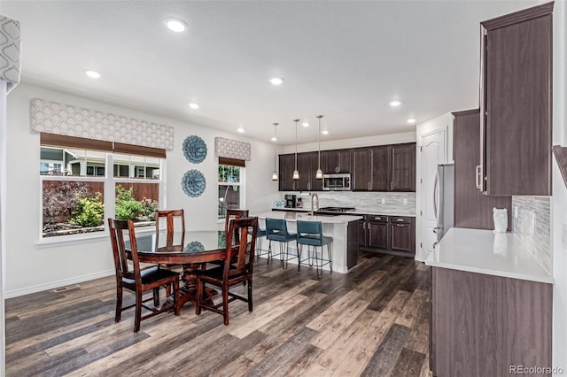 16321 Clayton St, Thornton, CO 80602 - dining space featuring dark wood-style flooring and recessed lighting