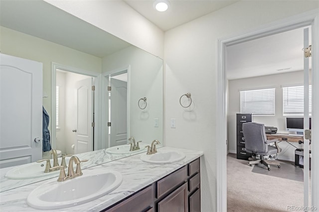 16321 Clayton St, Thornton, CO 80602 - bathroom featuring double vanity and baseboards