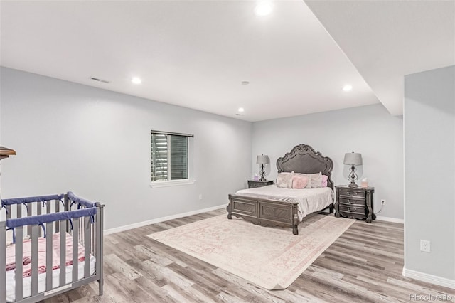 16321 Clayton St, Thornton, CO 80602 - bedroom featuring light wood-type flooring and recessed lighting