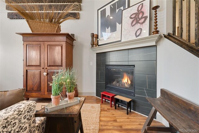 8872 E 47th Ave, Denver, CO 80238 - sitting room with wood finished floors and a tile fireplace