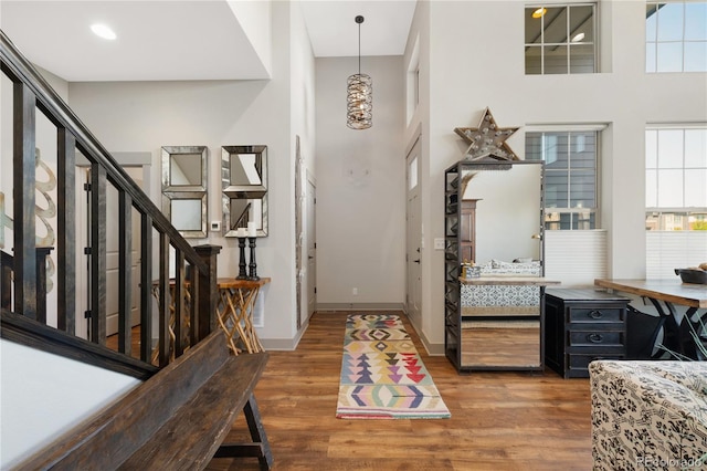 8872 E 47th Ave, Denver, CO 80238 - entryway featuring wood finished floors, plenty of natural light, a high ceiling, and stairway
