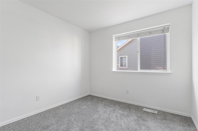 unfurnished room with carpet flooring