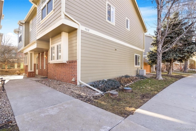 view of property exterior with central AC