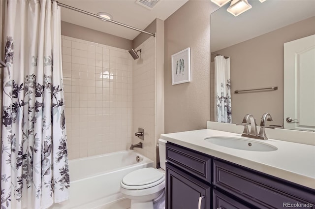 full bath with toilet, shower / bath combo, and vanity