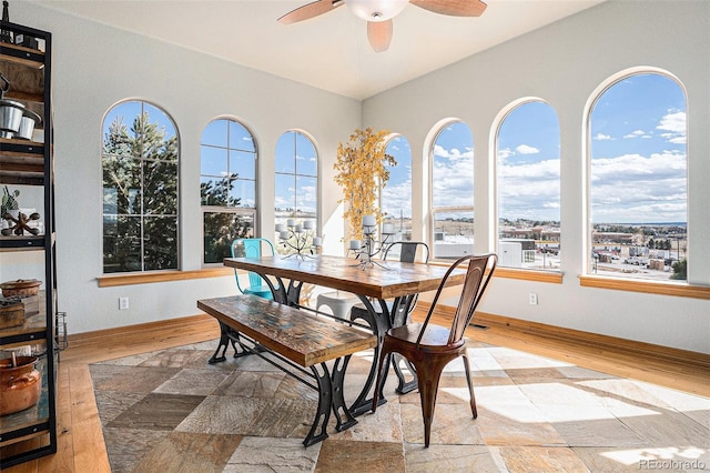 12161 S Leaning Pine Ct, Parker, CO 80134 - dining area featuring baseboards, a ceiling fan, and wood finished floors