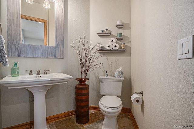 12161 S Leaning Pine Ct, Parker, CO 80134 - bathroom with baseboards, tile patterned floors, and toilet