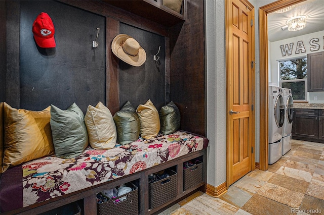 12161 S Leaning Pine Ct, Parker, CO 80134 - mudroom featuring separate washer and dryer, baseboards, and stone tile floors