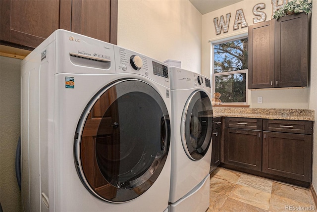 12161 S Leaning Pine Ct, Parker, CO 80134 - clothes washing area featuring stone finish flooring, cabinet space, and washing machine and dryer