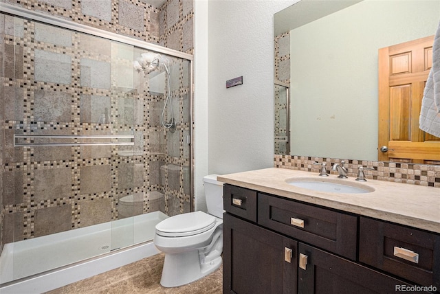 12161 S Leaning Pine Ct, Parker, CO 80134 - bathroom with decorative backsplash, toilet, a shower stall, and vanity