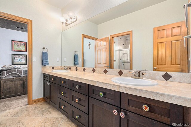 12161 S Leaning Pine Ct, Parker, CO 80134 - bathroom with a sink, a stall shower, double vanity, and visible vents