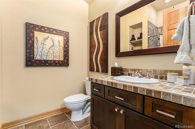 12161 S Leaning Pine Ct, Parker, CO 80134 - bathroom with vanity, baseboards, tile patterned floors, and toilet