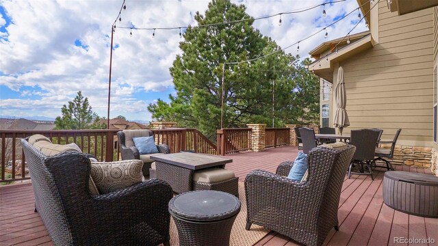 12161 S Leaning Pine Ct, Parker, CO 80134 - wooden terrace with outdoor dining space