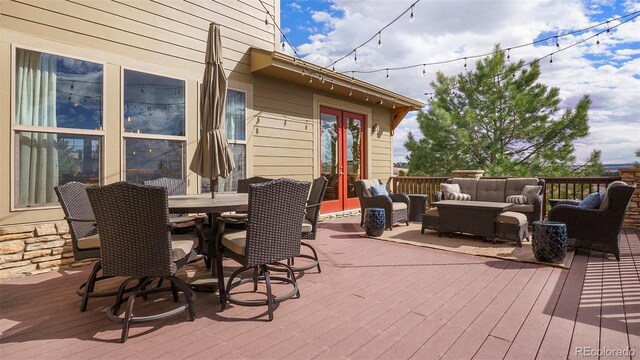 12161 S Leaning Pine Ct, Parker, CO 80134 - deck featuring outdoor dining area, french doors, and an outdoor hangout area