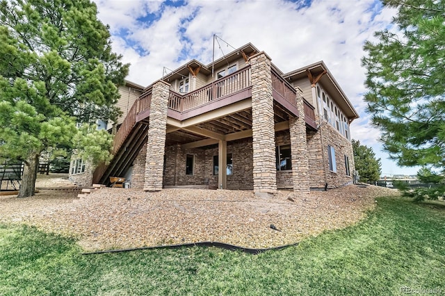 12161 S Leaning Pine Ct, Parker, CO 80134 - rear view of house featuring a lawn, a deck, and stone siding