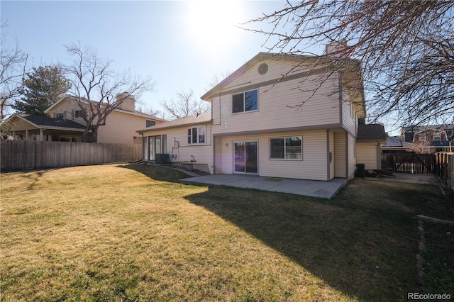 back of property featuring a fenced backyard, central air condition unit, a yard, and a patio area