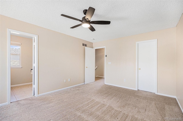 9651 Lameria Dr, Highlands Ranch, CO 80130 - unfurnished bedroom with carpet floors, a textured ceiling, ensuite bath, and a ceiling fan