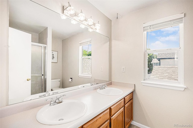 9651 Lameria Dr, Highlands Ranch, CO 80130 - full bathroom featuring double vanity and a shower with door
