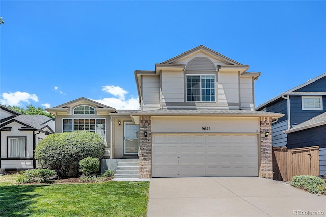 9651 Lameria Dr, Highlands Ranch, CO 80130 - traditional home featuring concrete driveway, an attached garage, and brick siding