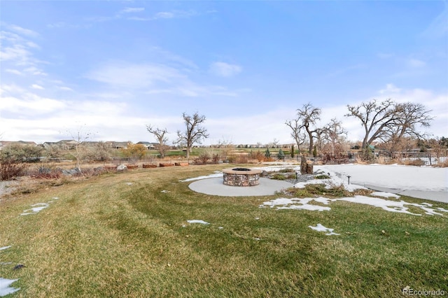 view of yard with an outdoor fire pit