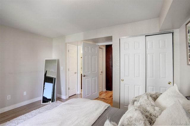 bedroom featuring a closet and light hardwood / wood-style flooring