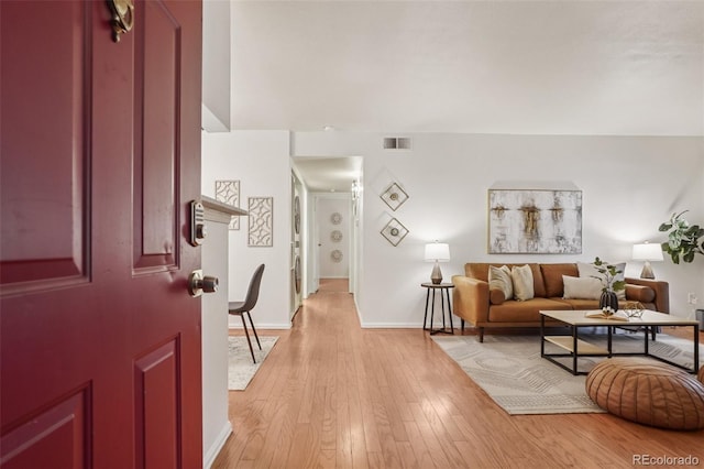 8335 Fairmount Dr Unit 5-106, Denver, CO 80247 - entrance foyer featuring baseboards and light wood-type flooring