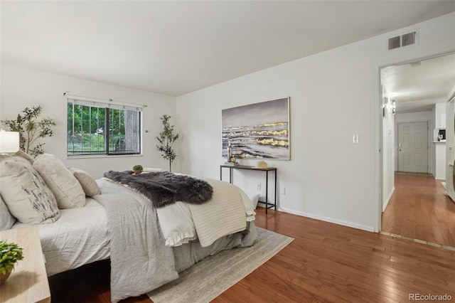 8335 Fairmount Dr Unit 5-106, Denver, CO 80247 - bedroom with wood finished floors and baseboards