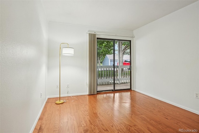 8335 Fairmount Dr Unit 5-106, Denver, CO 80247 - spare room featuring light wood-style floors and baseboards
