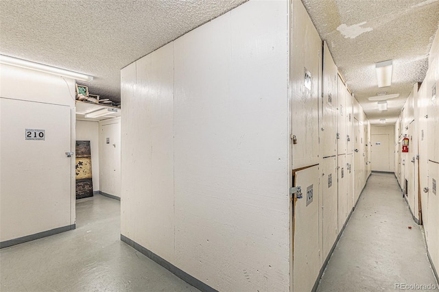 corridor with a textured ceiling