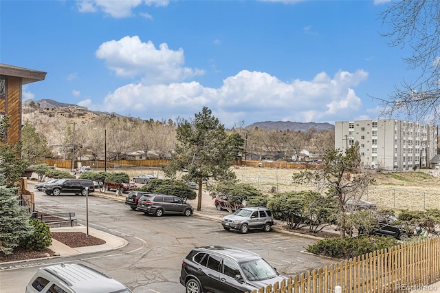 view of car parking with a mountain view