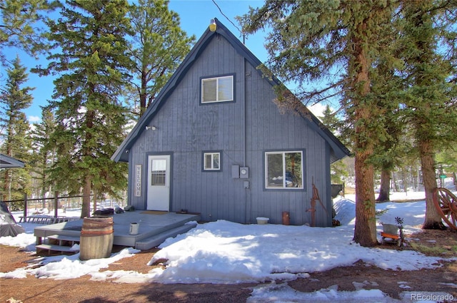 397 Will Scarlet Dr, Divide, CO 80814 - snow covered rear of property featuring a wooden deck