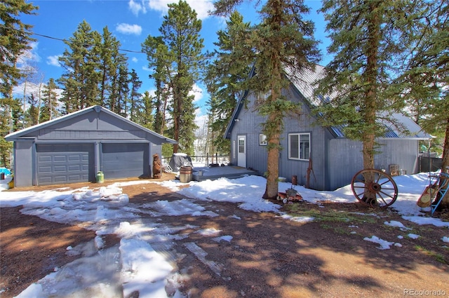 397 Will Scarlet Dr, Divide, CO 80814 - snow covered garage featuring a detached garage