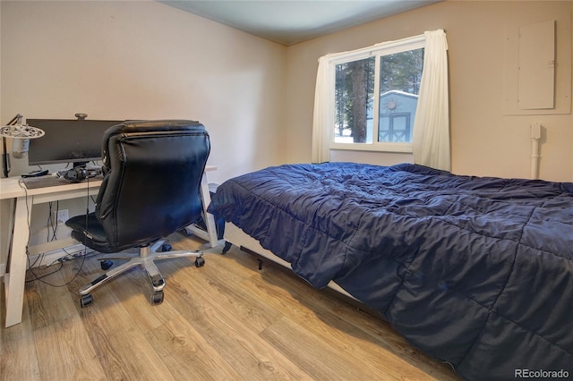 397 Will Scarlet Dr, Divide, CO 80814 - bedroom featuring wood finished floors, electric panel, and an office area