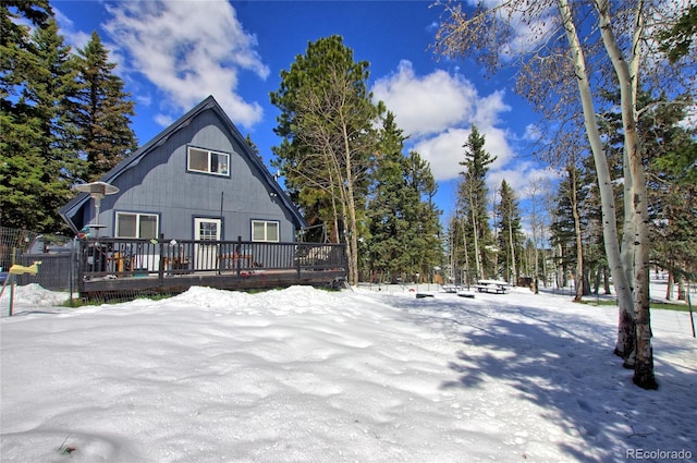 397 Will Scarlet Dr, Divide, CO 80814 - snow covered back of property featuring a wooden deck