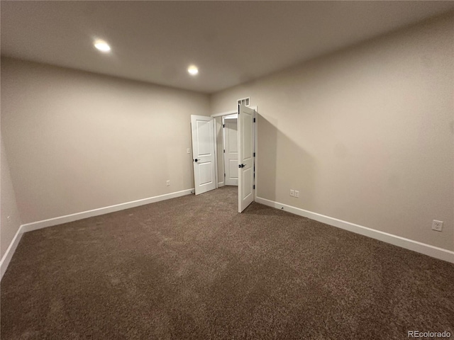 unfurnished bedroom featuring dark colored carpet