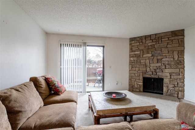 living room featuring carpet flooring, a fireplace, and a textured ceiling