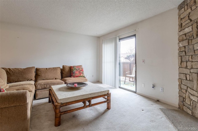 living room featuring light carpet and a textured ceiling