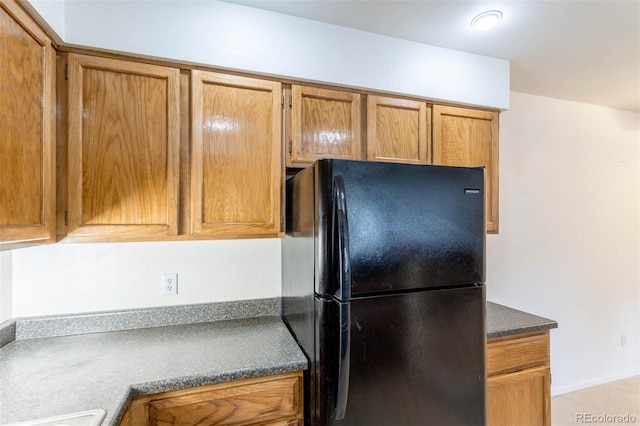 kitchen featuring black fridge