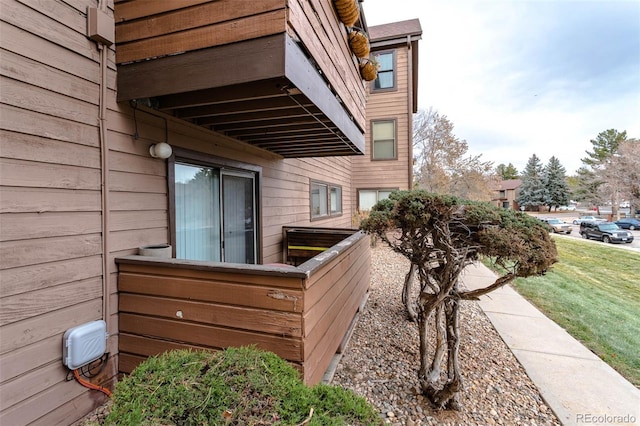 view of side of home featuring a lawn