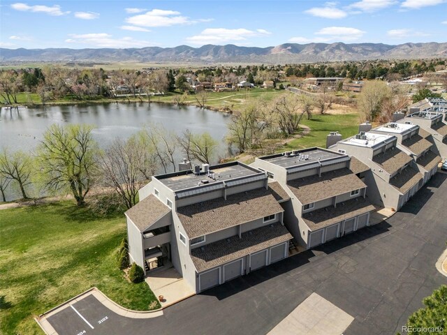 10520 W Jewell Ave Unit 102, Lakewood, CO 80232 - drone / aerial view featuring a water and mountain view