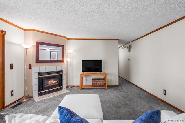10520 W Jewell Ave Unit 102, Lakewood, CO 80232 - carpeted living room with a tile fireplace, crown molding, and baseboards
