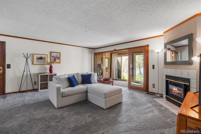 10520 W Jewell Ave Unit 102, Lakewood, CO 80232 - carpeted living area with a tiled fireplace, baseboards, a textured ceiling, and crown molding