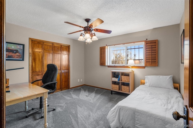 10520 W Jewell Ave Unit 102, Lakewood, CO 80232 - carpeted bedroom featuring baseboards, a textured ceiling, a closet, and ceiling fan